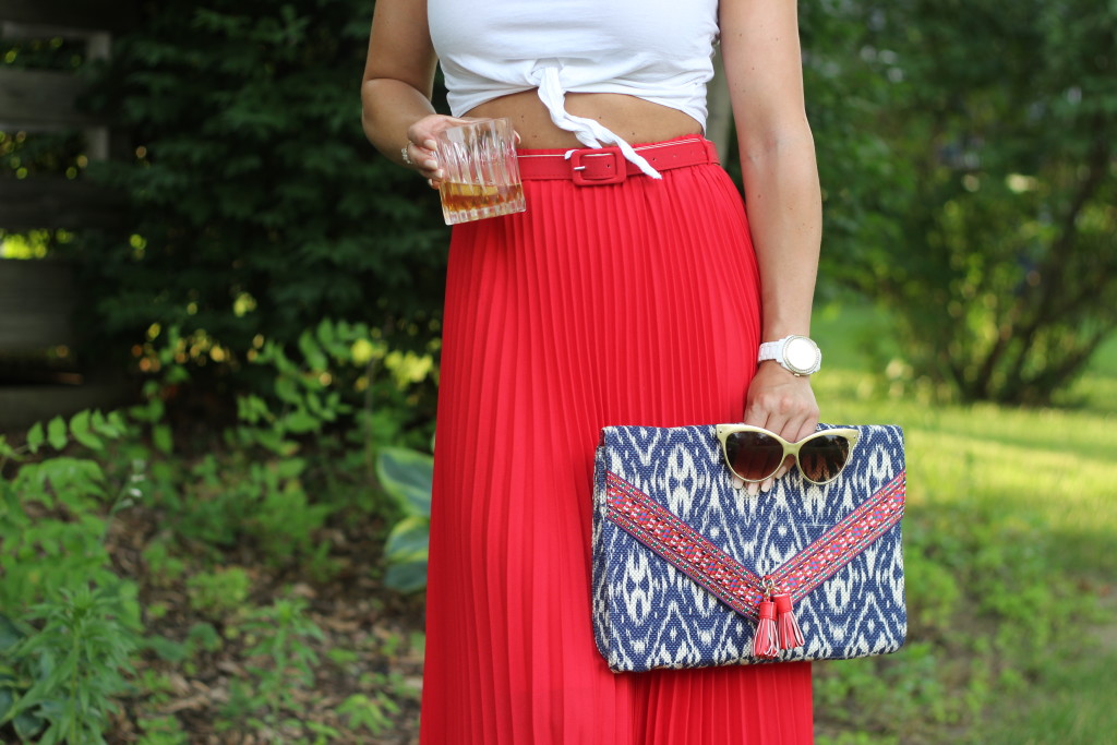 red white and blue, summer style, pleated maxi skirt, long red skirt, belted skirt, ikat, ikat clutch, cat eye sun glasses, front tie crop top, white crop top