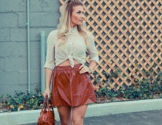 A deep red leather skater skirt paired with a victorian style button up blouse.